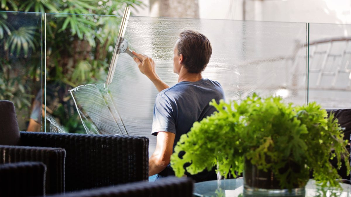 stock photo of man cleaning glass